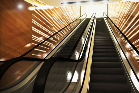 Conceptual Rendering of LED Backlit Illuminated 3Form and Wood Striped Wall Panels at Escalator